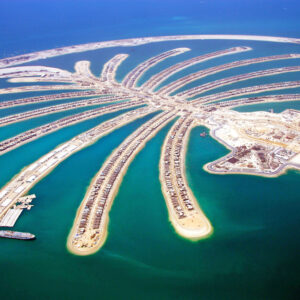 In this photo released by the Nakheel Development, construction goes on at Jumeira Palm Island in Dubai, United Arab Emirates.    With 14,000 laborers toiling day and night, the first of Dubai's three palm-shaped islands is just four months away from its first residents moving in, the developer says. (AP Photo/Nakheel Development, HO)